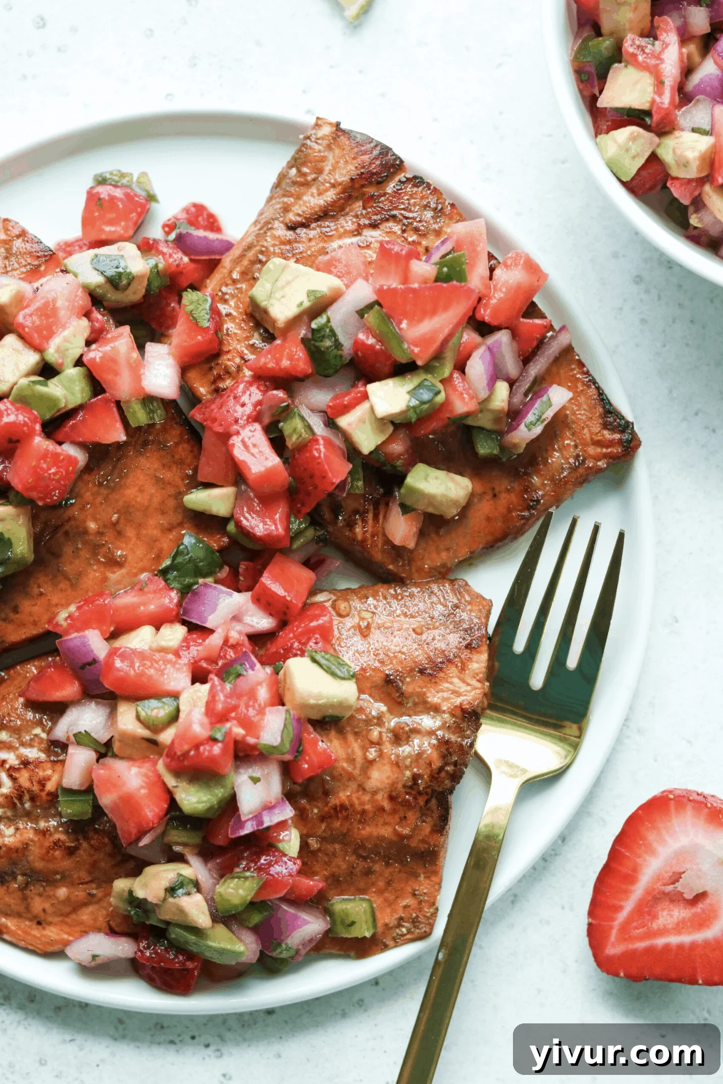 Balsamic Grilled Salmon with Strawberry Avocado Salsa served on a plate