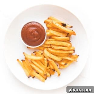 Keto french fry dipped in ketchup