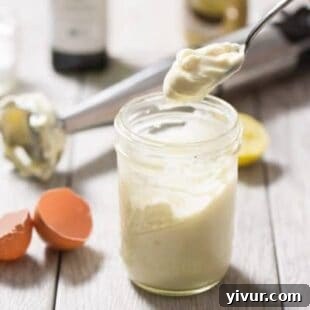 Freshly made homemade keto mayonnaise in a jar