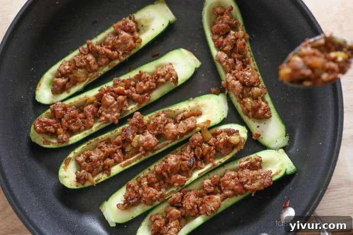 All zucchini halves stuffed with sausage