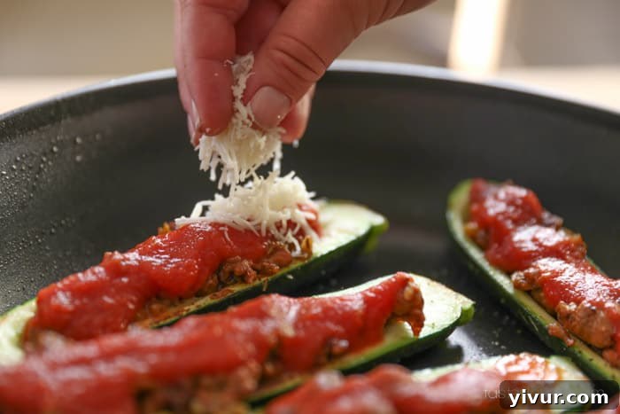 Stuffed zucchini topped with mozzarella cheese