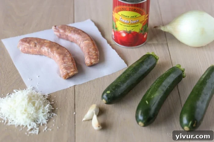 Sausage Stuffed Zucchini Ingredients on a cutting board