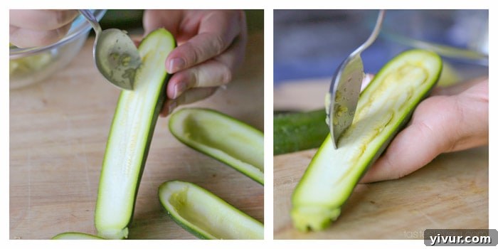 Scooping out zucchini flesh for stuffing