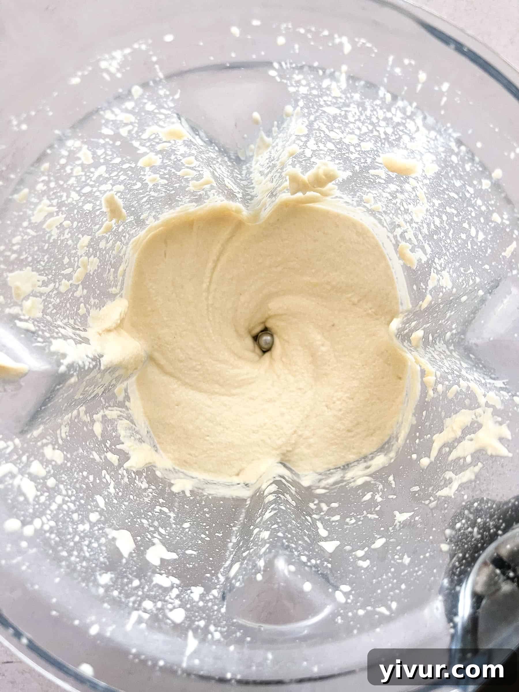 Dairy-free ricotta ingredients blending in a high-speed blender for a smooth consistency.