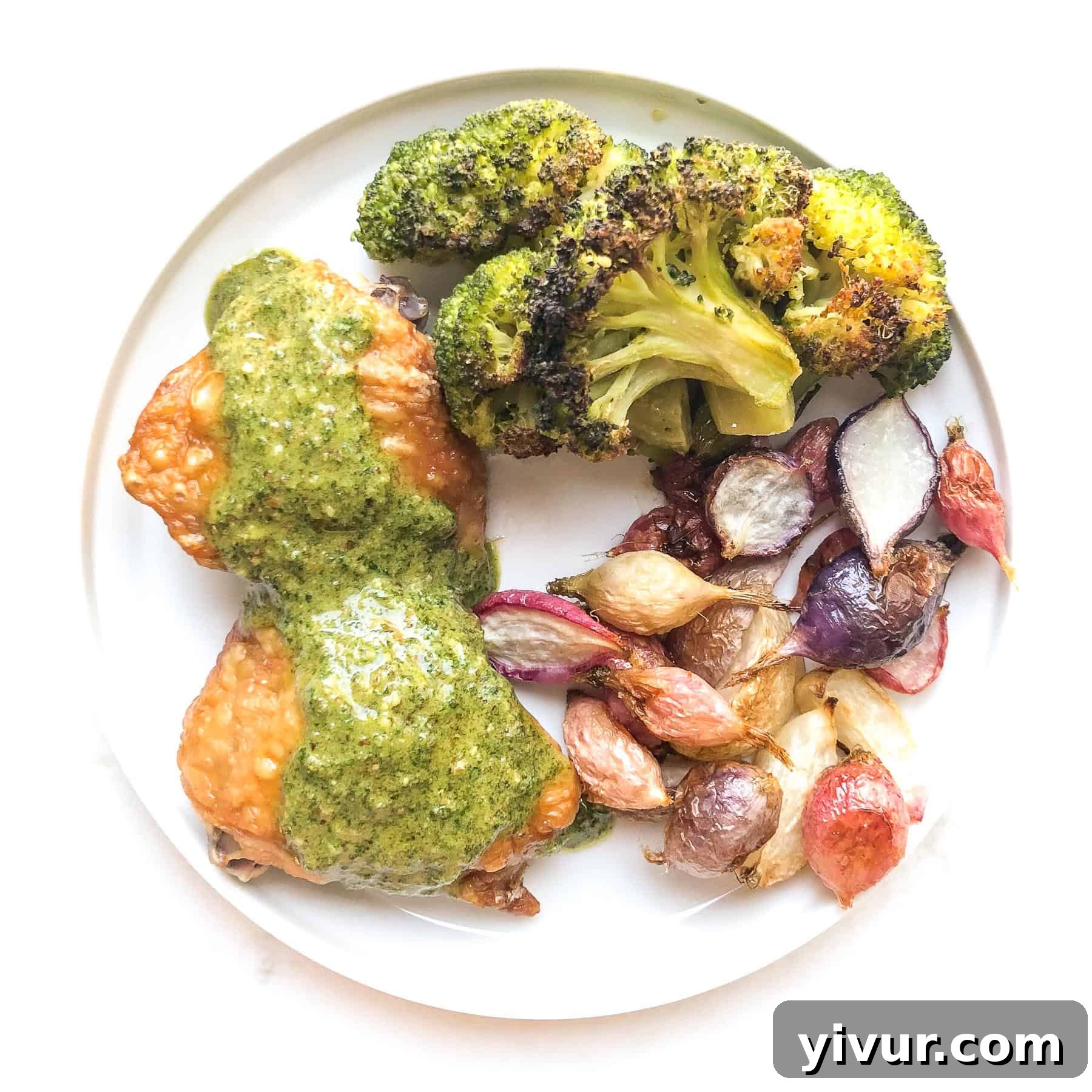 Tender chicken thighs drizzled with a vibrant orange parsley sauce, a flavorful keto and Whole30 meal.