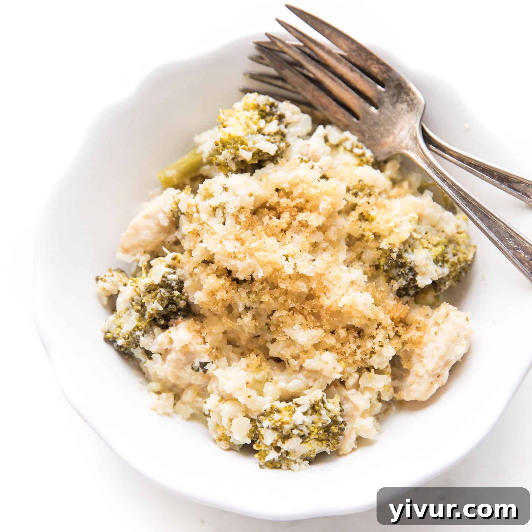 A bubbling Keto creamy chicken cauliflower rice casserole, perfect for a comforting low-carb meal.