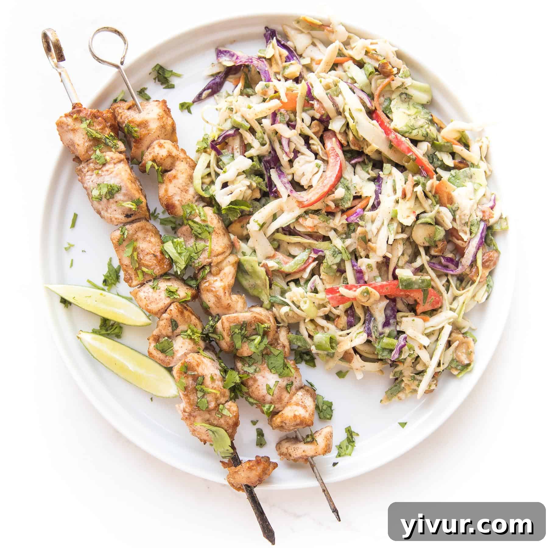 Delicious Thai chicken satay skewers served with a refreshing coleslaw, perfect for a keto, paleo, or Whole30 meal.