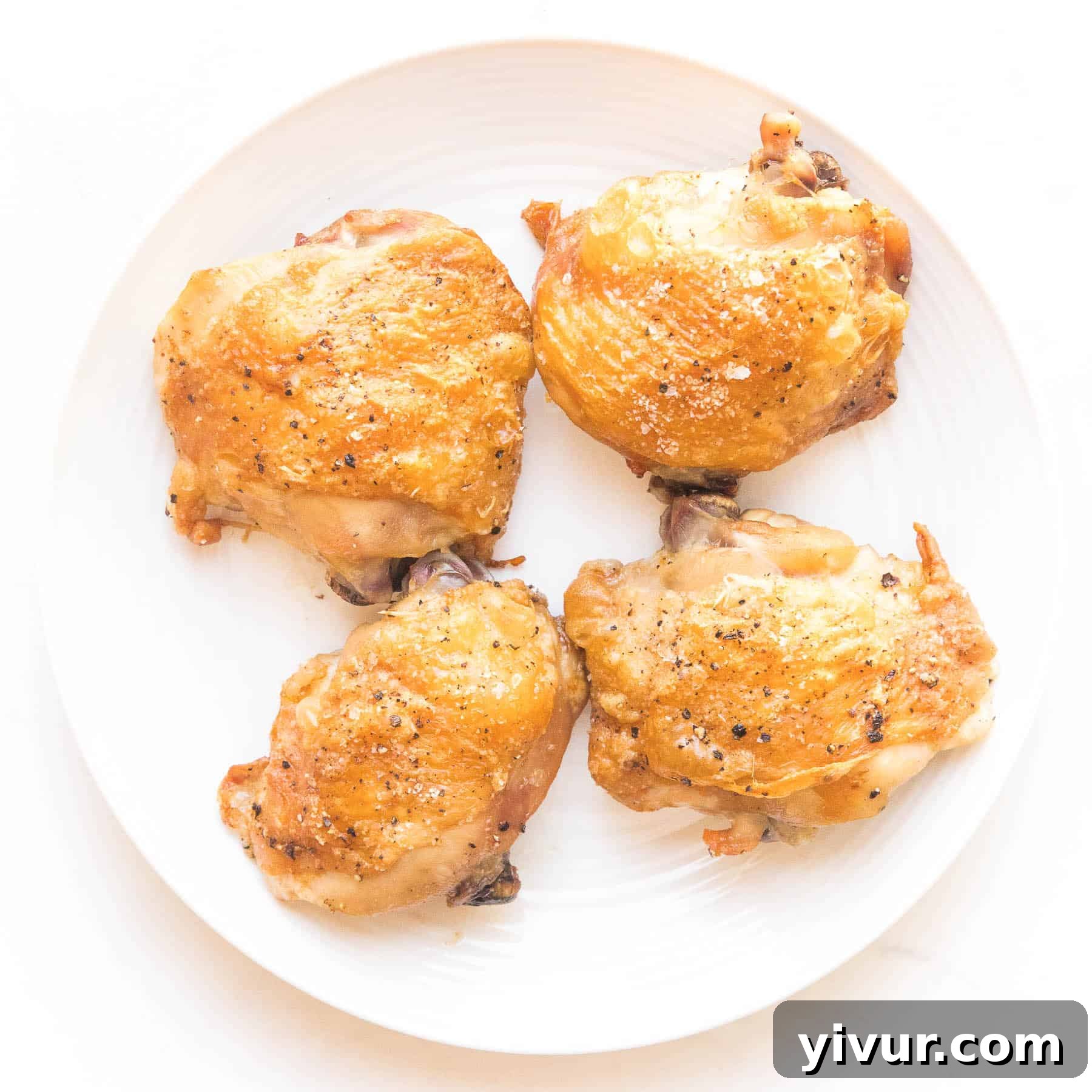 Perfectly crispy chicken thighs, golden brown and juicy, a simple yet satisfying keto and Whole30 dish.