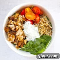 keto sheet pan chicken shawarma bowls in a white bowl with a white background