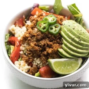 Easy Keto Ground Beef Burrito Bowl with seasoned beef, fajita veggies, and fresh toppings.