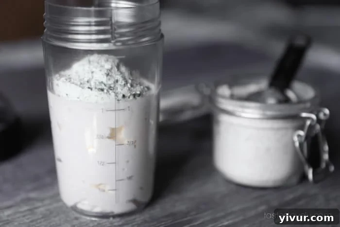 Whisking homemade ranch seasoning into mayonnaise