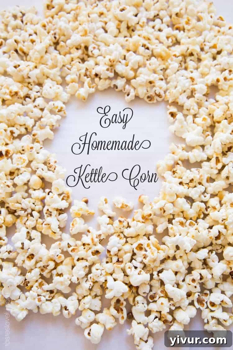 Freshly made kettle corn cooling on parchment paper, with a light sprinkle of salt visible on the surface.