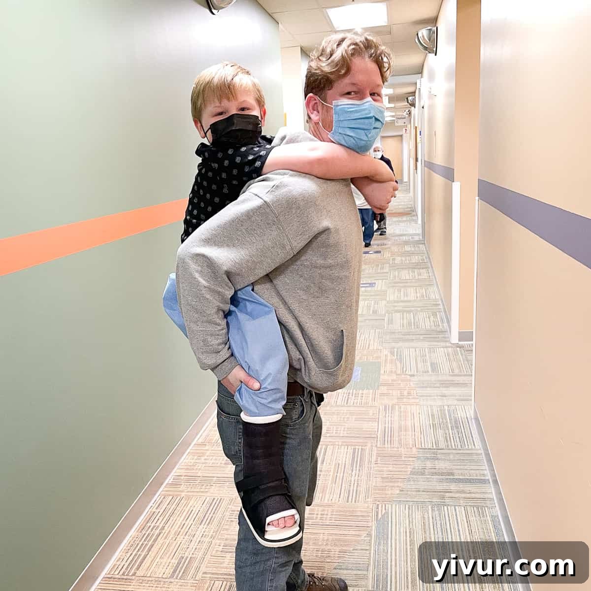 Josh's Unwavering Journey: Conquering Clubfeet 4 Josh, our incredibly joyful son, in his wheelchair, looking happy and demonstrating his resilience during his recovery from leg surgery.