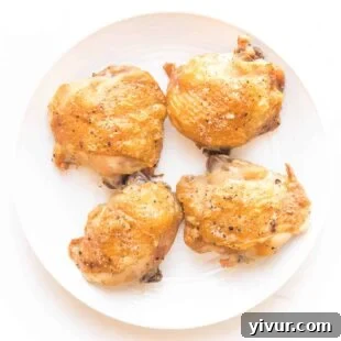 Close-up of perfectly crispy, golden-brown keto chicken thighs.