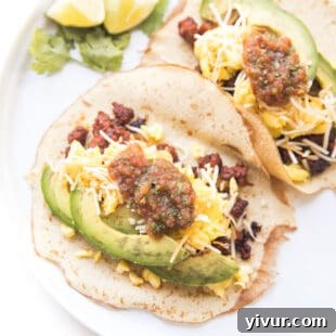 Make Dad's Day Delicious: Keto Recipes and Gift Ideas for Fathers Day 2022 19 Keto breakfast tacos filled with scrambled eggs, cheese, and avocado.