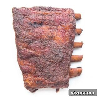 Make Dad's Day Delicious: Keto Recipes and Gift Ideas for Fathers Day 2022 4 Close-up of perfectly smoked ribs glistening with a pickle juice glaze, ready to be served.