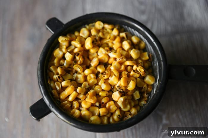Close-up of thawed frozen roasted corn, ready for salad assembly