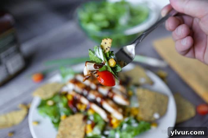 Close-up of a perfectly mixed and ready-to-eat BBQ Chicken Chopped Salad in a bowl