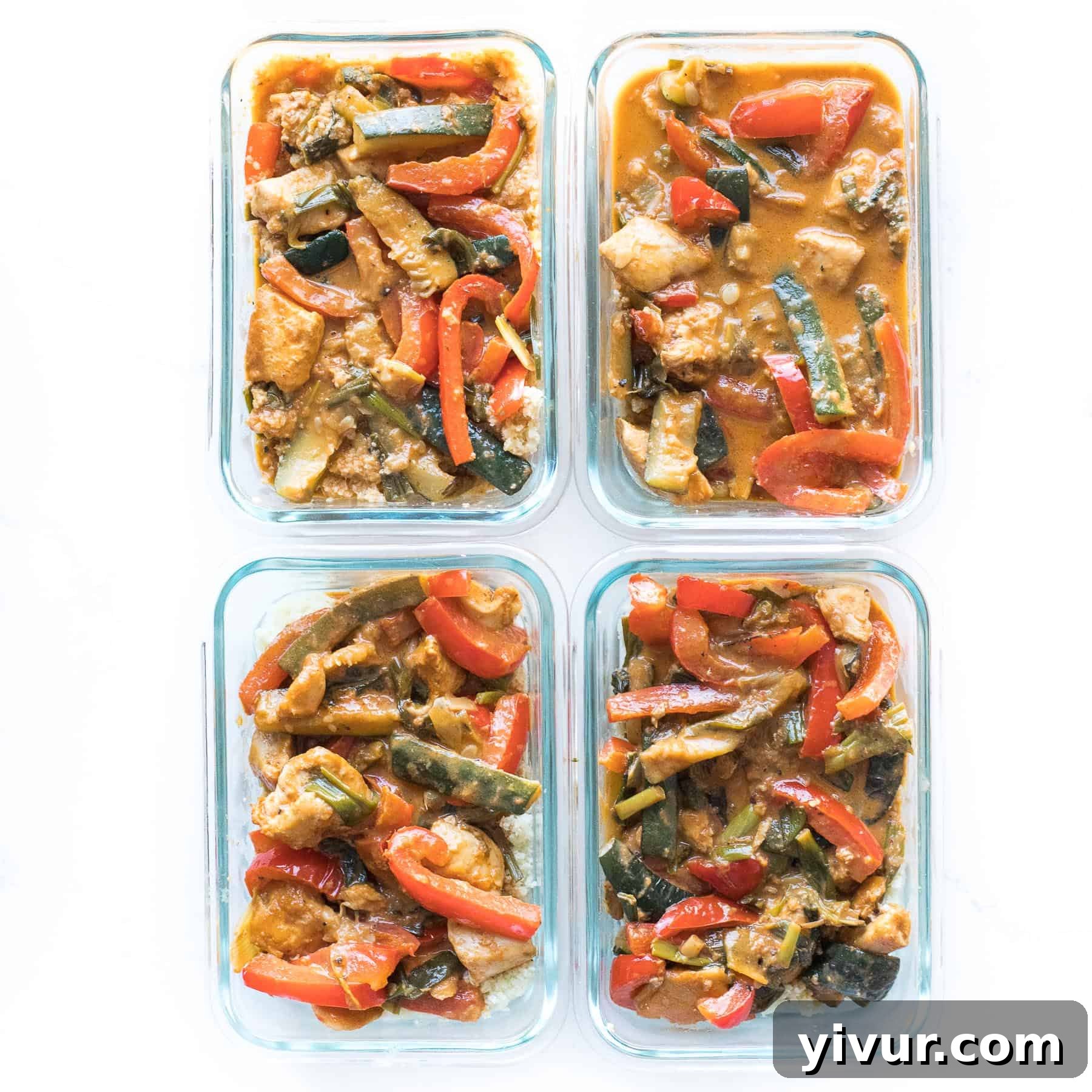30-Minute Keto Thai Coconut Chicken Curry 6 Chicken curry in glass meal prep containers with cauliflower rice, ready for storage.