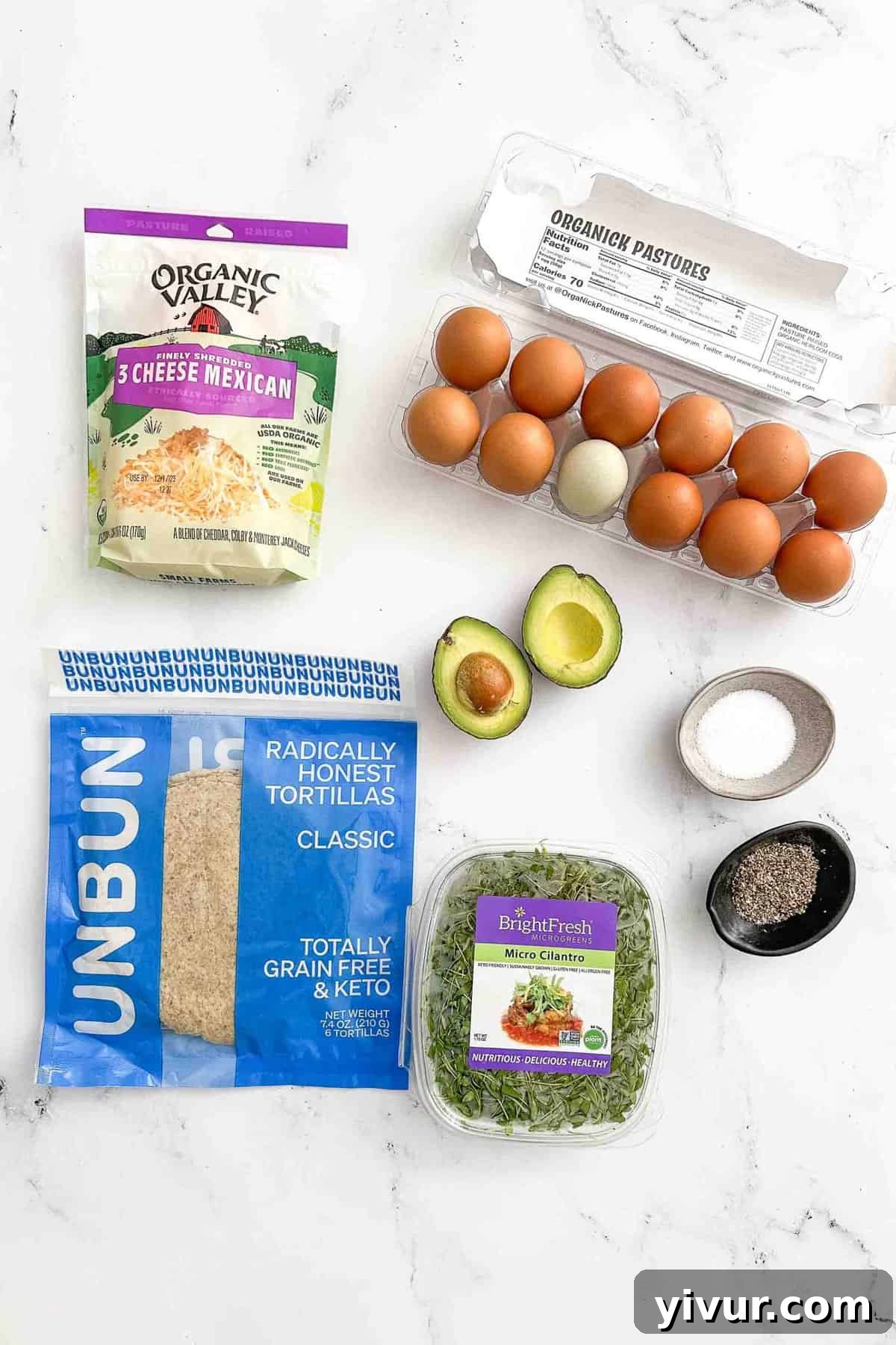 A flat lay photo showing the simple ingredients required for making crispy fried egg tacos: butter, cheese, an egg, and spices.