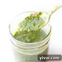 Whole30 Chimichurri Sauce in a small bowl with a spoon