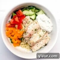 featured image of Greek yogurt chicken in a bowl with roasted vegetables.