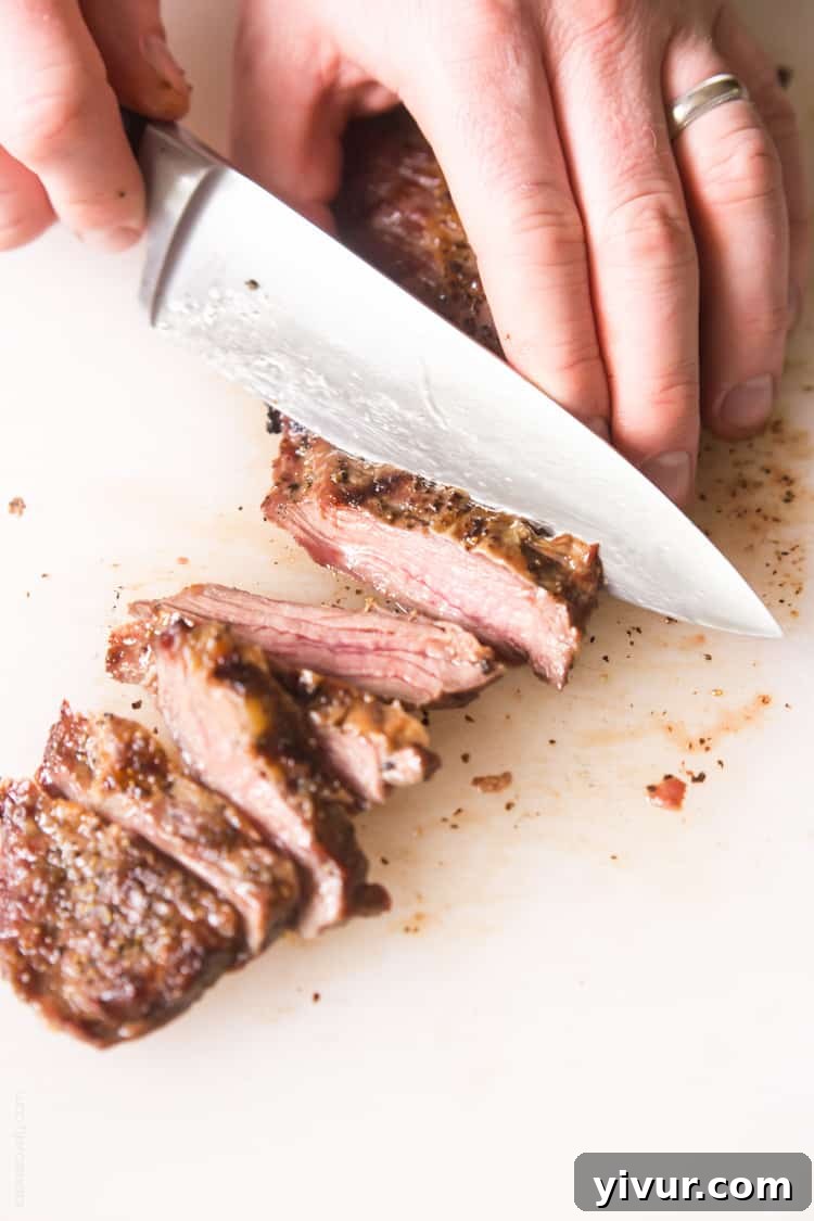 Juicy Skirt Steak generously covered in homemade Chimichurri Sauce, an ideal healthy and affordable steak recipe for grilling. Paleo, Whole30, Gluten-Free, Low-Carb friendly.