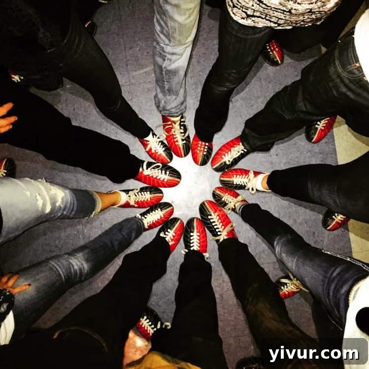Friends laughing and enjoying a bowling game, celebrating a birthday