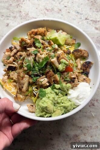Low-carb chicken burrito bowl with fresh ingredients for a healthy dinner