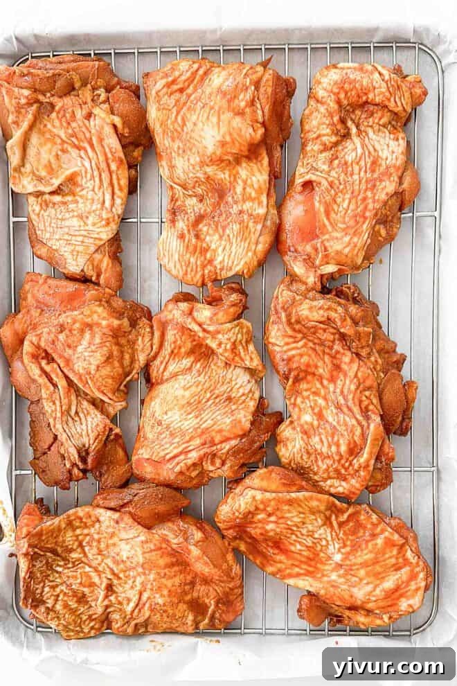 marinated chicken thighs on a wire rack