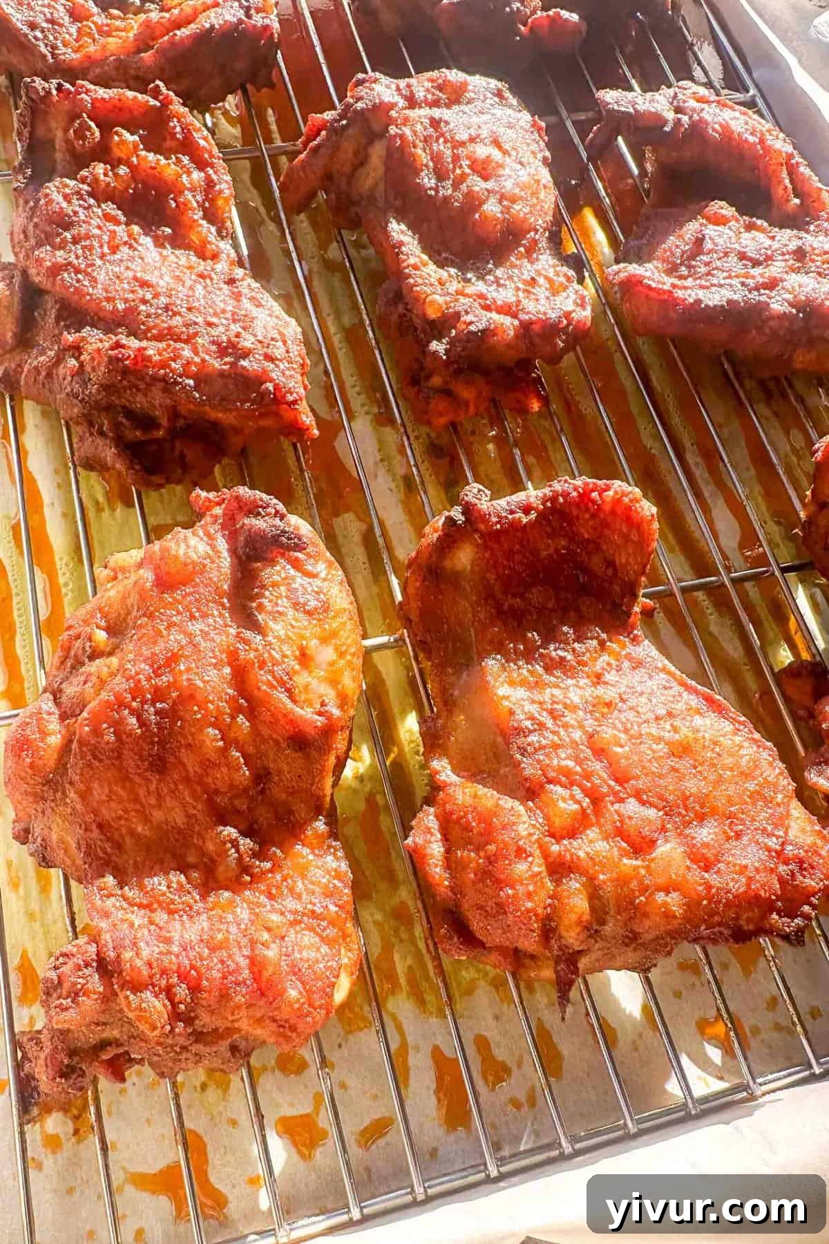 chicken shawarma thighs cooked and resting on a wire rack 