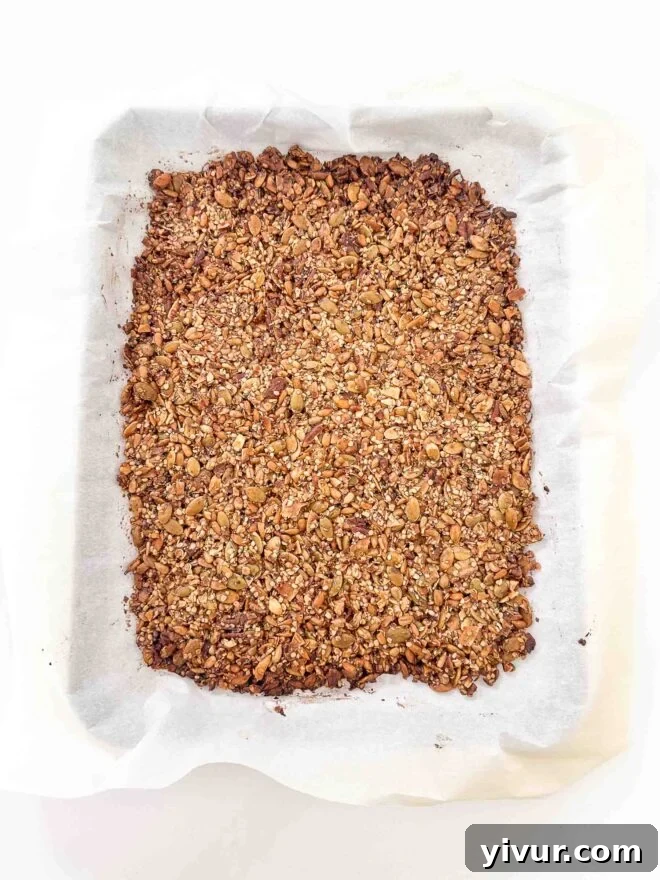 baked granola on a baking sheet 