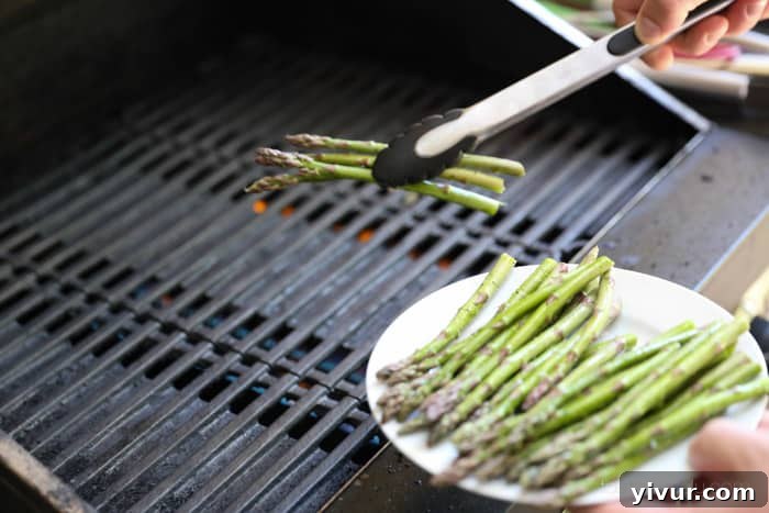 Perfect Grilled Asparagus 10 Asparagus spears arranged on a hot grill