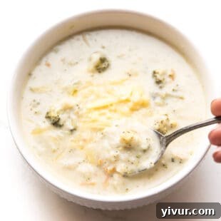 instant pot keto broccoli cheddar soup in a white bowl