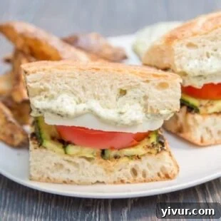 Grilled zucchini Caprese sandwich, a vegetarian delight with fresh ingredients.