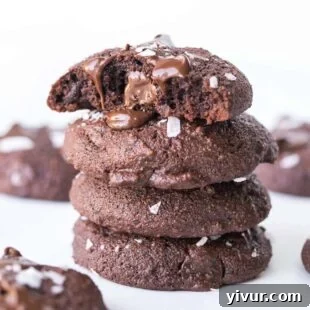 Close-up of keto salted chocolate brownie cookies, showcasing their crinkled tops and a sprinkle of sea salt.