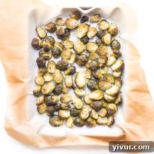 Roasted Brussels sprouts on a rimmed baking sheet