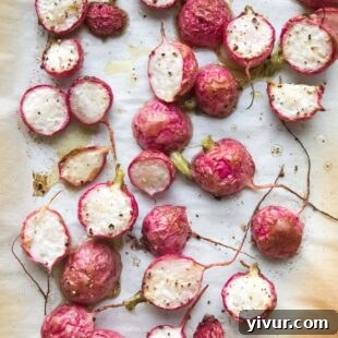 Roasted radishes on a rimmed baking sheet