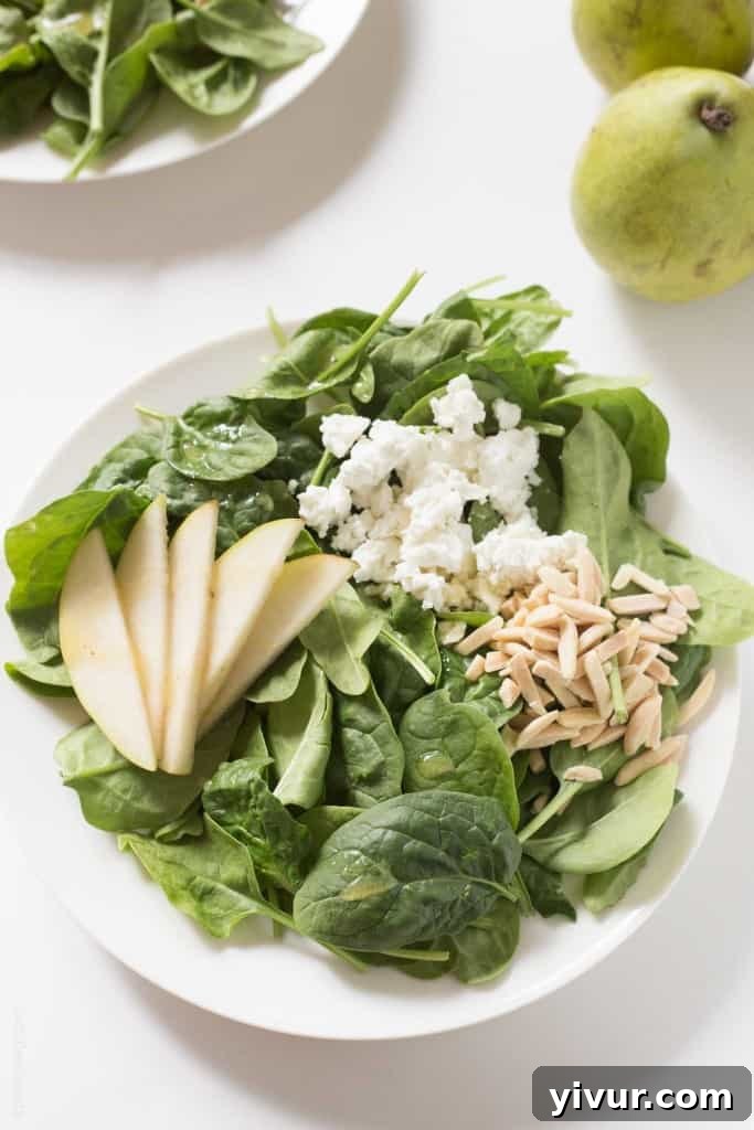 Sweet Pear and Tangy Goat Cheese Spinach Salad 4 Ingredients for Pear and Goat Cheese Spinach Salad, including crisp spinach, juicy pears, and tangy goat cheese. #glutenfree #vegetarian