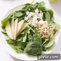 Sweet Pear and Tangy Goat Cheese Spinach Salad 5 Close up of Pear and Goat Cheese Spinach Salad with Champagne Vinaigrette