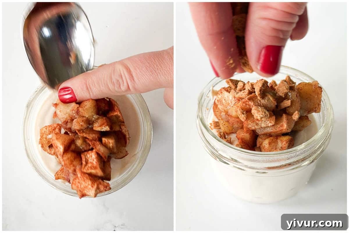 topping cottage cheese cheesecake with baked apple and graham crackers.