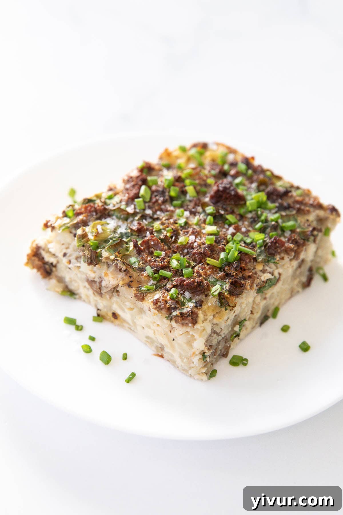 High Protein Bison Breakfast Casserole with Potatoes and Eggs on a white plate, showcasing a hearty and healthy breakfast option