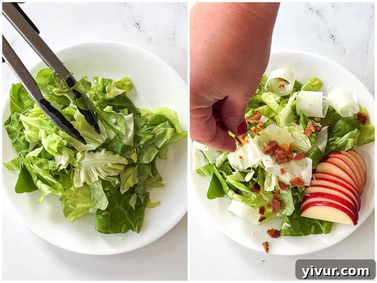The finished Butter Leaf Lettuce Salad, beautifully assembled with dressed lettuce, sliced apples, crispy bacon, and shaved parmesan, ready to be served.