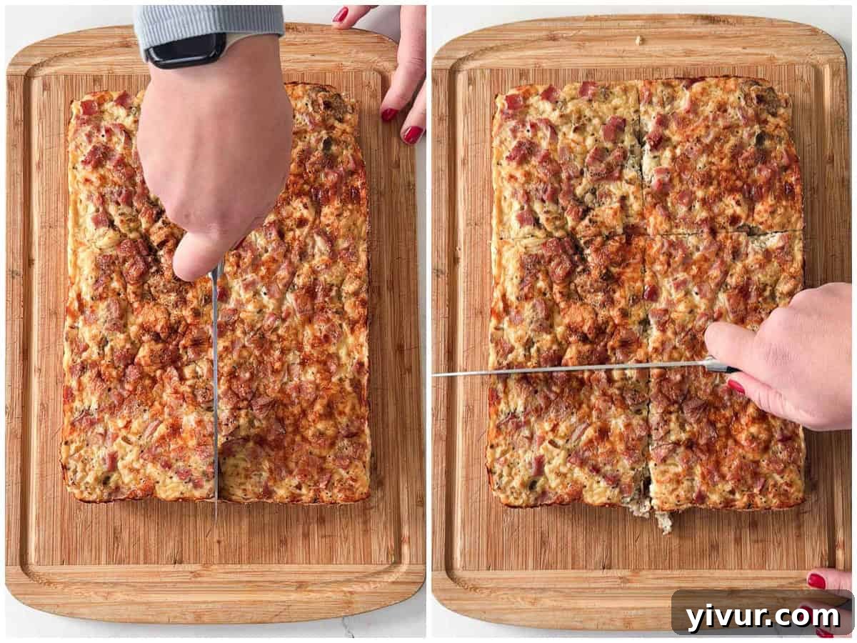 High Protein Ham and Cheese Egg Casserole being lifted from the baking dish using parchment paper