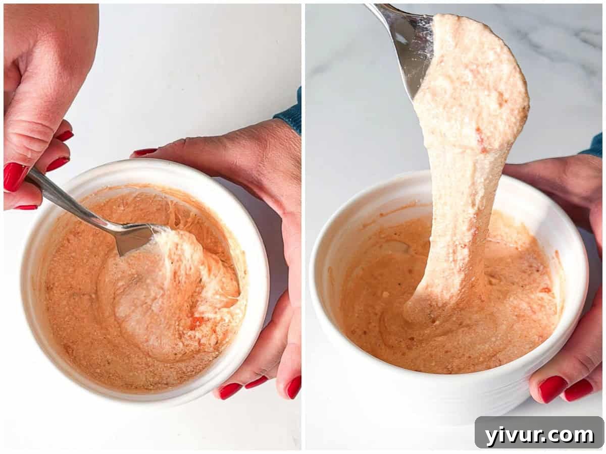 Stir together the melted ingredients for High Protein Pizza Dip with Cottage Cheese and Pepperoni