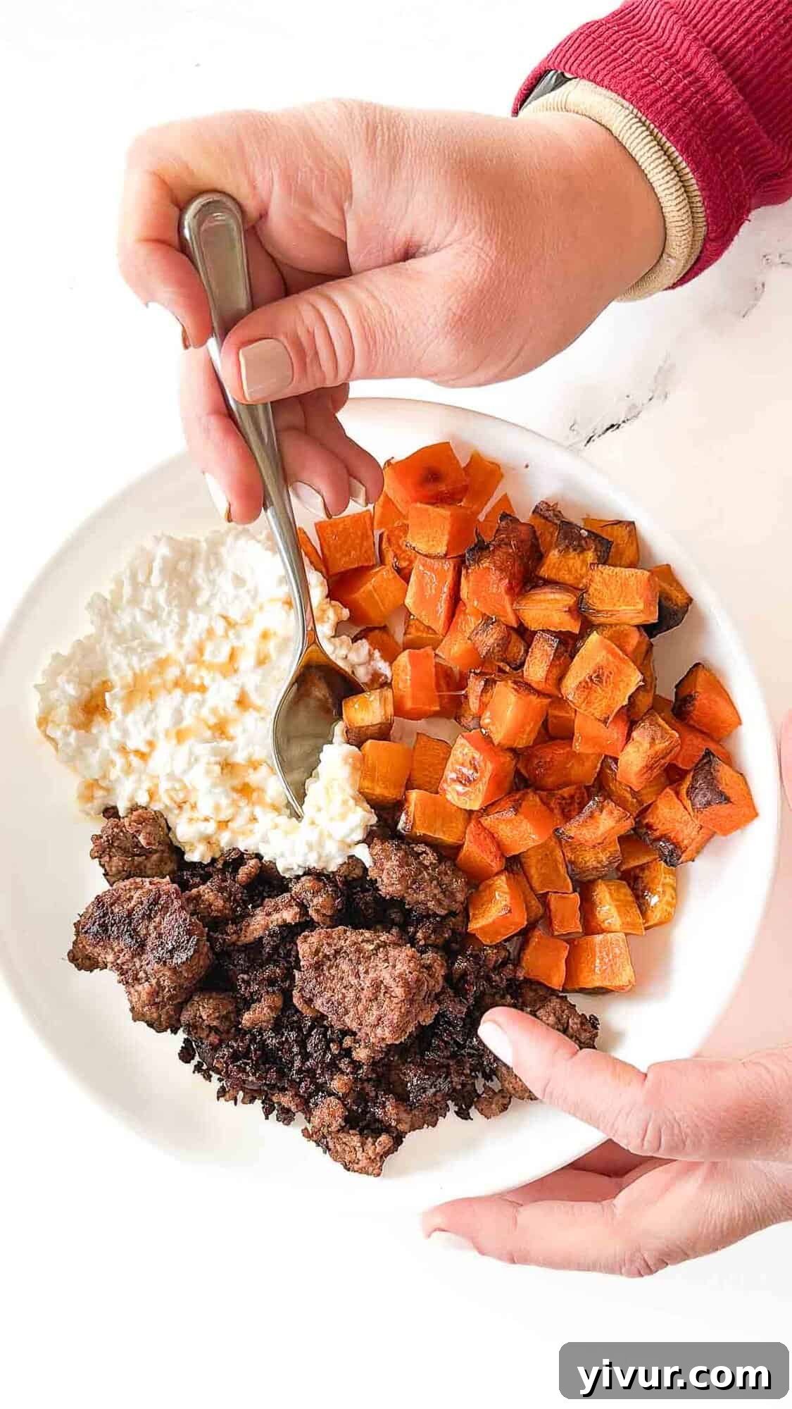 A vibrant and appetizing high protein bison bowl with cottage cheese and butternut squash, drizzled with hot honey, ready to eat.