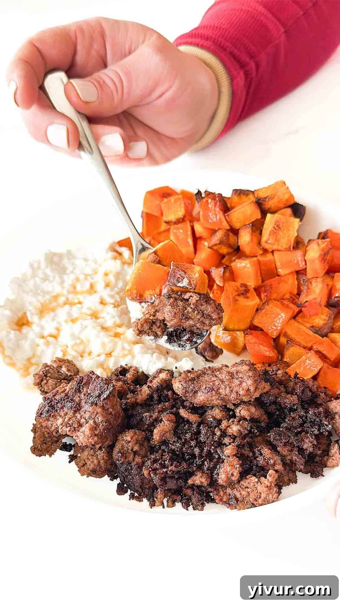 A close-up view of the High Protein Bison Bowl, highlighting the textures of the lean bison, roasted butternut squash, creamy cottage cheese, and glossy hot honey.