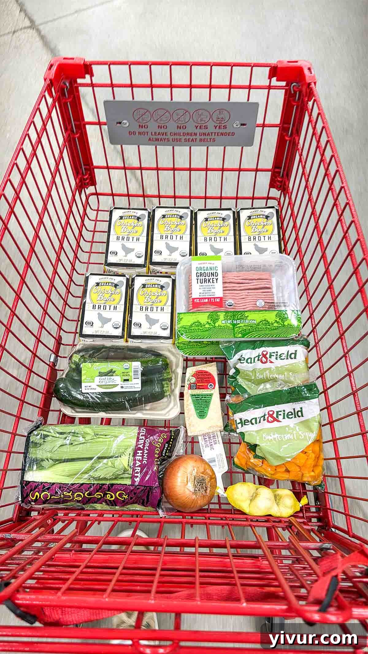 Assorted fresh ingredients laid out for High Protein Turkey and Butternut Squash Soup, including ground turkey, butternut squash, zucchini, celery, onion, garlic, bone broth, and avocado oil spray.