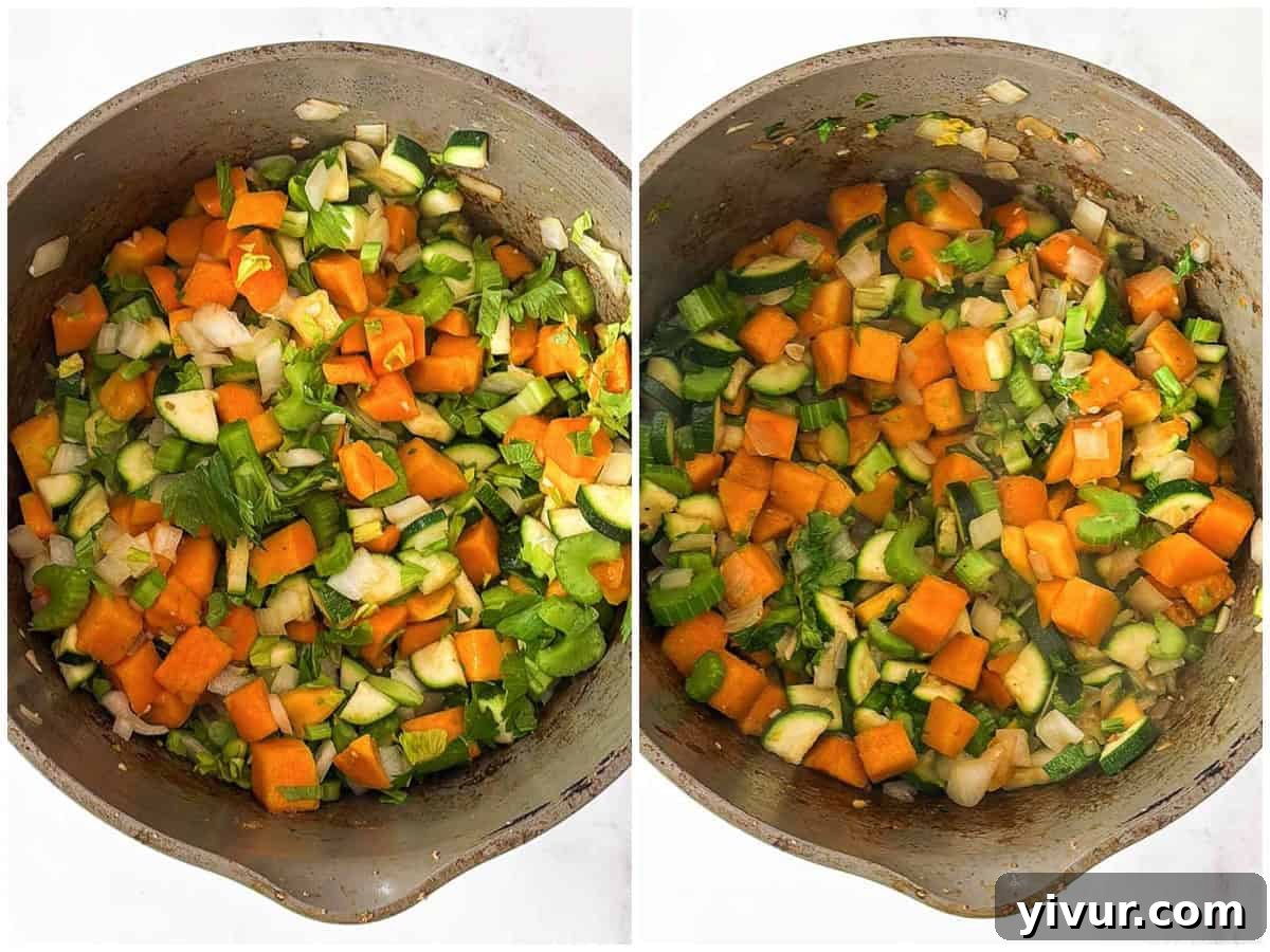 Chopped vegetables (butternut squash, zucchini, celery, onion, garlic) sautéing in a pot.