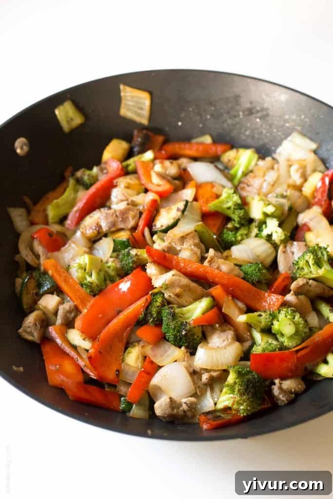 Sizzling Chicken Stir Fry with Broccoli and Sweet Peppers 4 Broccoli and bell pepper chicken stir fry, made with the BEST stir fry sauce!
